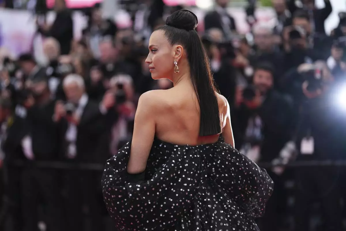 Irina Shayk poses for photographers during the opening ceremony red carpet of the 78th international film festival, Cannes, southern France, Tuesday, May 13, 2025. (Photo by Scott A Garfitt/Invision/AP)