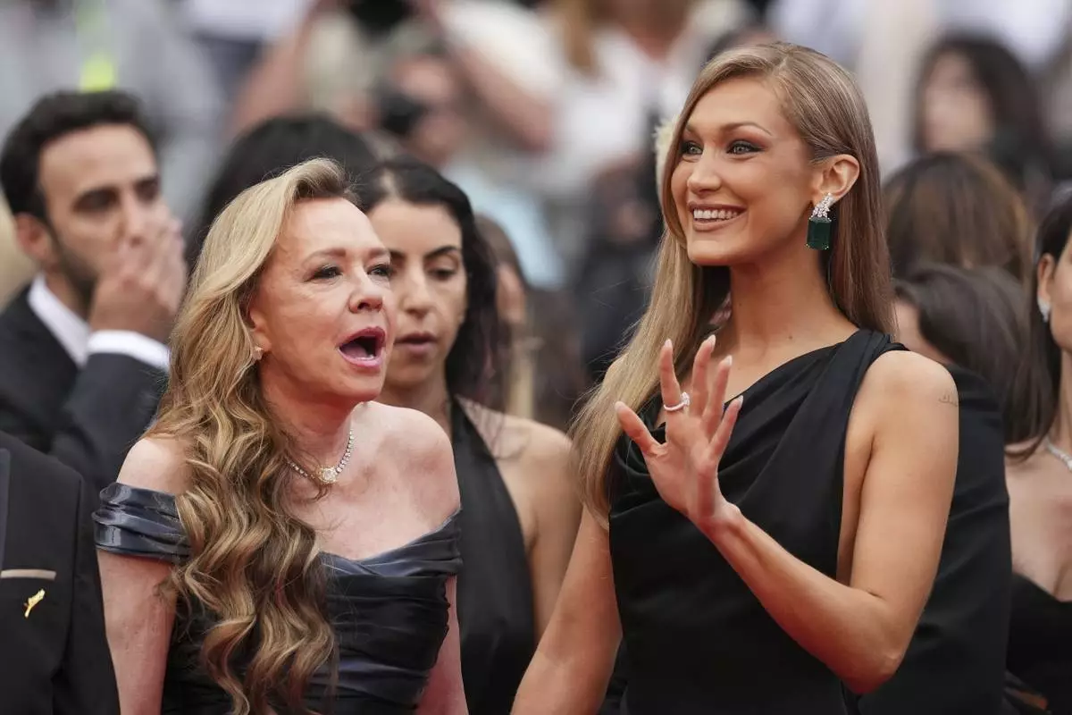 Christine Scheufele, left, and Bella Hadid pose for photographers during the opening ceremony red carpet of the 78th international film festival, Cannes, southern France, Tuesday, May 13, 2025. (Photo by Scott A Garfitt/Invision/AP)