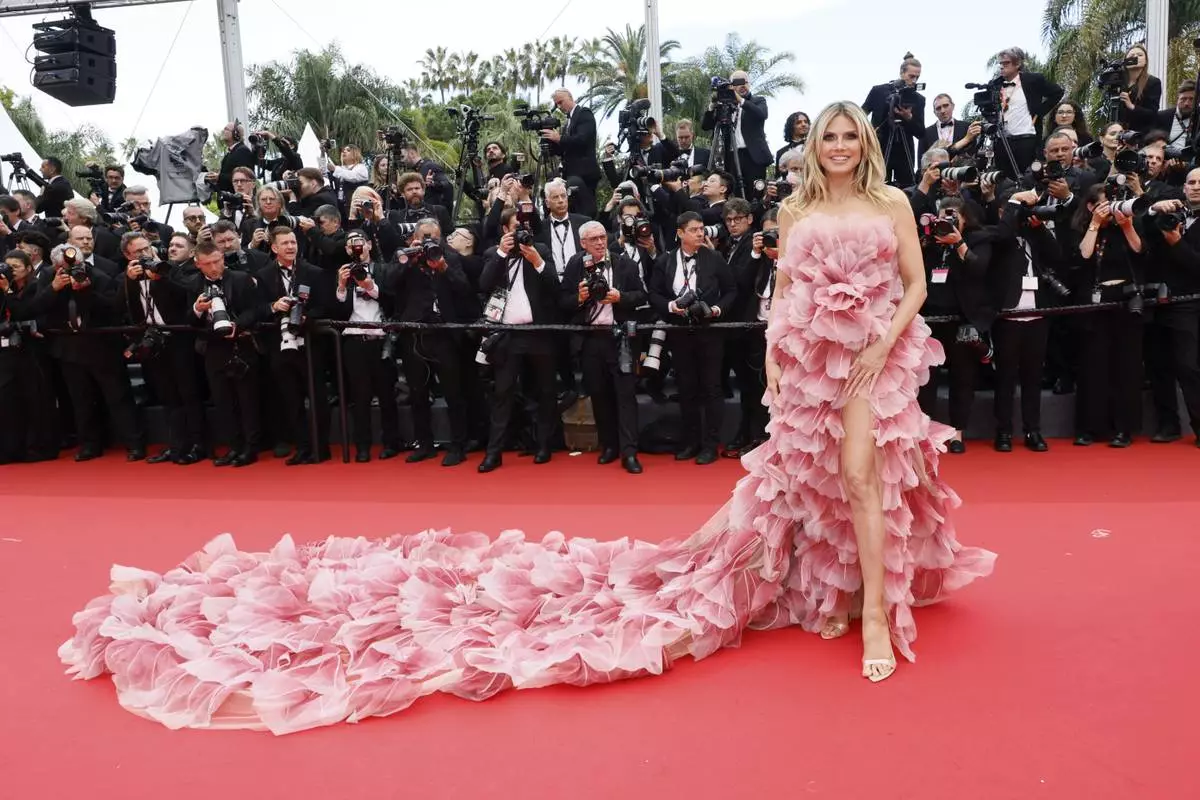Heidi Klum poses for photographers during the opening ceremony red carpet of the 78th international film festival, Cannes, southern France, Tuesday, May 13, 2025. (Photo by Joel C Ryan/Invision/AP)