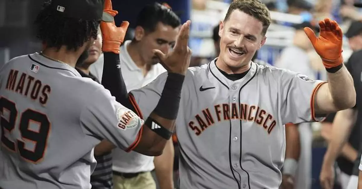 Chapman homers, Harrison pitches five scoreless innings as Giants beat Marlins 2-0