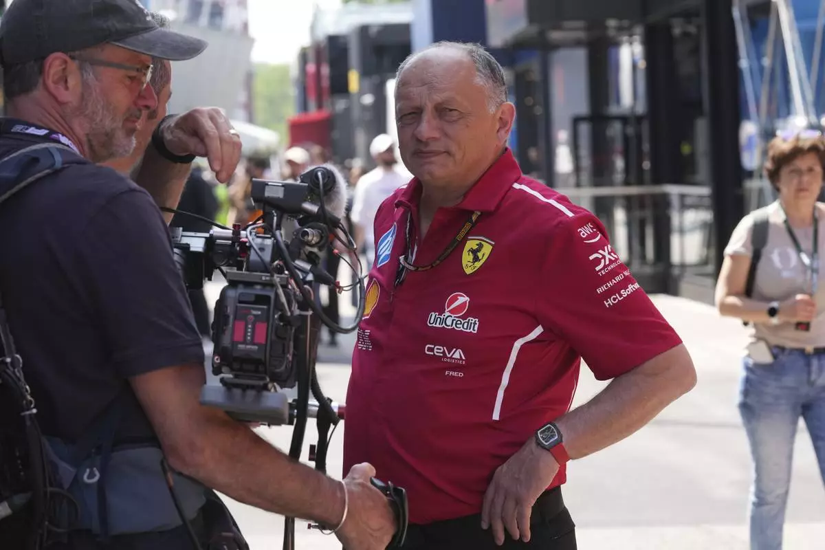 Ferrari team principal Frederic Vasseur watches in the paddock at the Enzo and Dino Ferrari racetrack, ahead the Italy's Emilia Romagna Formula One Grand Prix in Imola, Italy, Thursday, May 15, 2025. (AP Photo/Antonio Calanni)