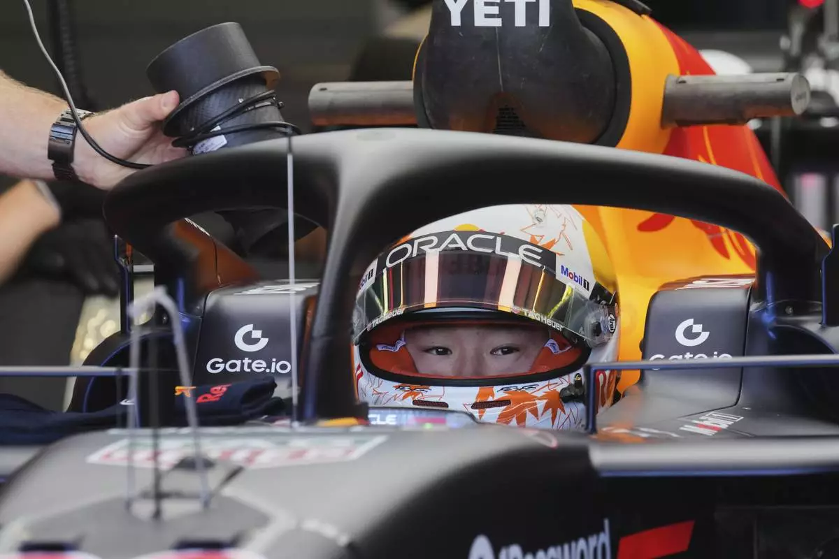 Red Bull driver Yuki Tsunoda of Japan sits in his car during the first free practice at the Enzo and Dino Ferrari racetrack, ahead the Italy's Emilia Romagna Formula One Grand Prix, in Imola, Italy, Friday, May 16, 2025. (AP Photo/Antonio Calanni)
