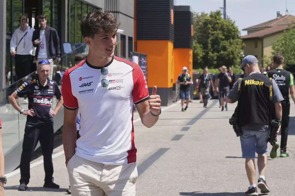 Haas driver Oliver Bearman of Britain arrives for the first free practice at the Enzo and Dino Ferrari racetrack, ahead the Italy's Emilia Romagna Formula One Grand Prix, in Imola, Italy, Friday, May 16, 2025. (AP Photo/Antonio Calanni)