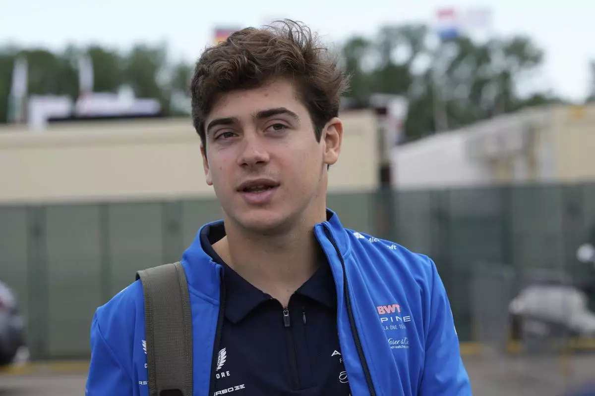 Alpine driver Franco Colapinto of Argentina arrives prior to the first free practice at the Enzo and Dino Ferrari racetrack, ahead the Italy's Emilia Romagna Formula One Grand Prix, in Imola, Italy, Friday, May 16, 2025. (AP Photo/Luca Bruno)