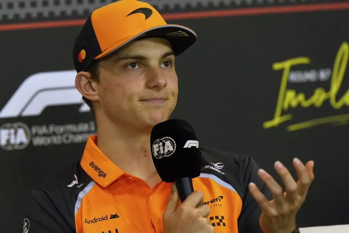 McLaren driver Oscar Piastri of Australia answers reporters during a news conference at the Enzo and Dino Ferrari racetrack, ahead the Italy's Emilia Romagna Formula One Grand Prix in Imola, Italy, Thursday, May 15, 2025. (AP Photo/Luca Bruno)