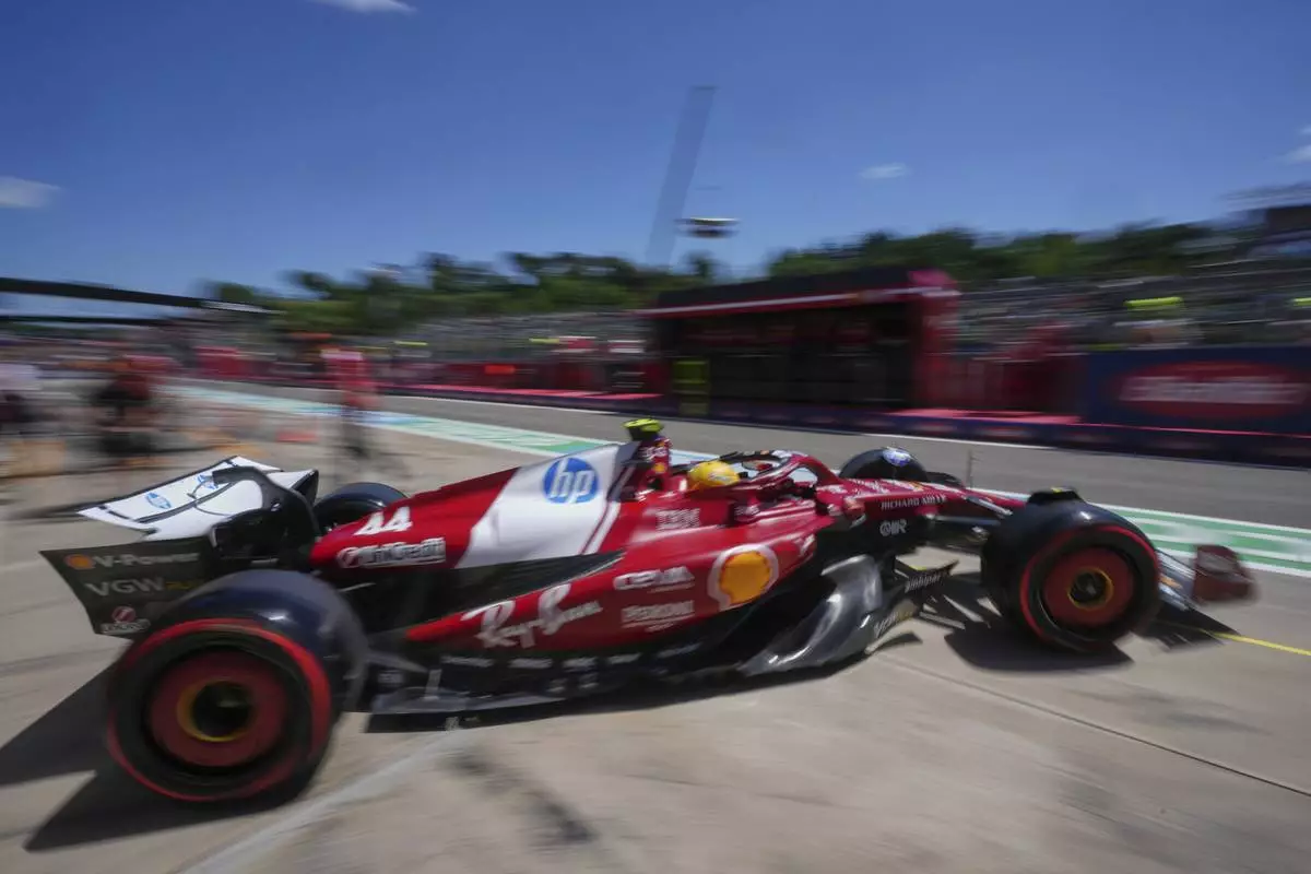 Ferrari driver Lewis Hamilton of Britain leaves the pitlane during the first free practice at the Enzo and Dino Ferrari racetrack, ahead the Italy's Emilia Romagna Formula One Grand Prix, in Imola, Italy, Friday, May 16, 2025. (AP Photo/Antonio Calanni)