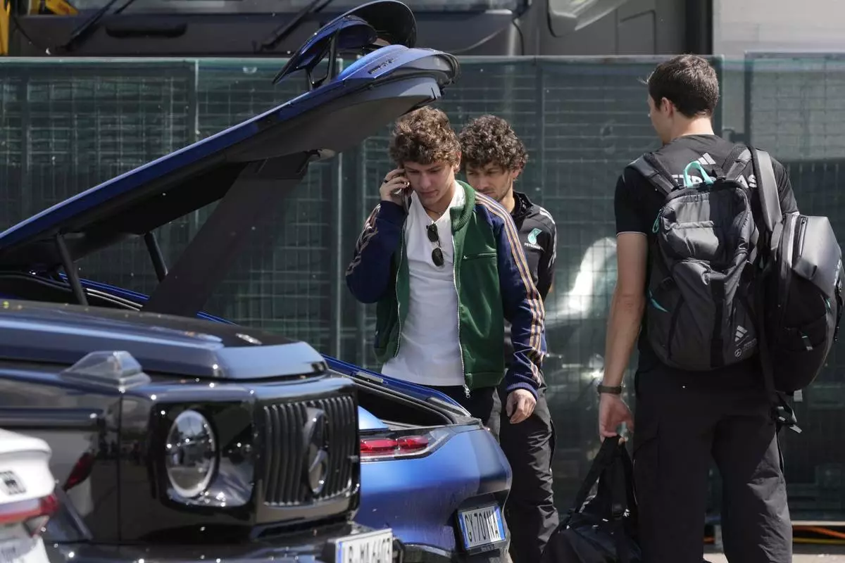 Mercedes driver Andrea Kimi Antonelli of Italy arrives prior to the first free practice at the Enzo and Dino Ferrari racetrack, ahead the Italy's Emilia Romagna Formula One Grand Prix, in Imola, Italy, Friday, May 16, 2025. (AP Photo/Luca Bruno)