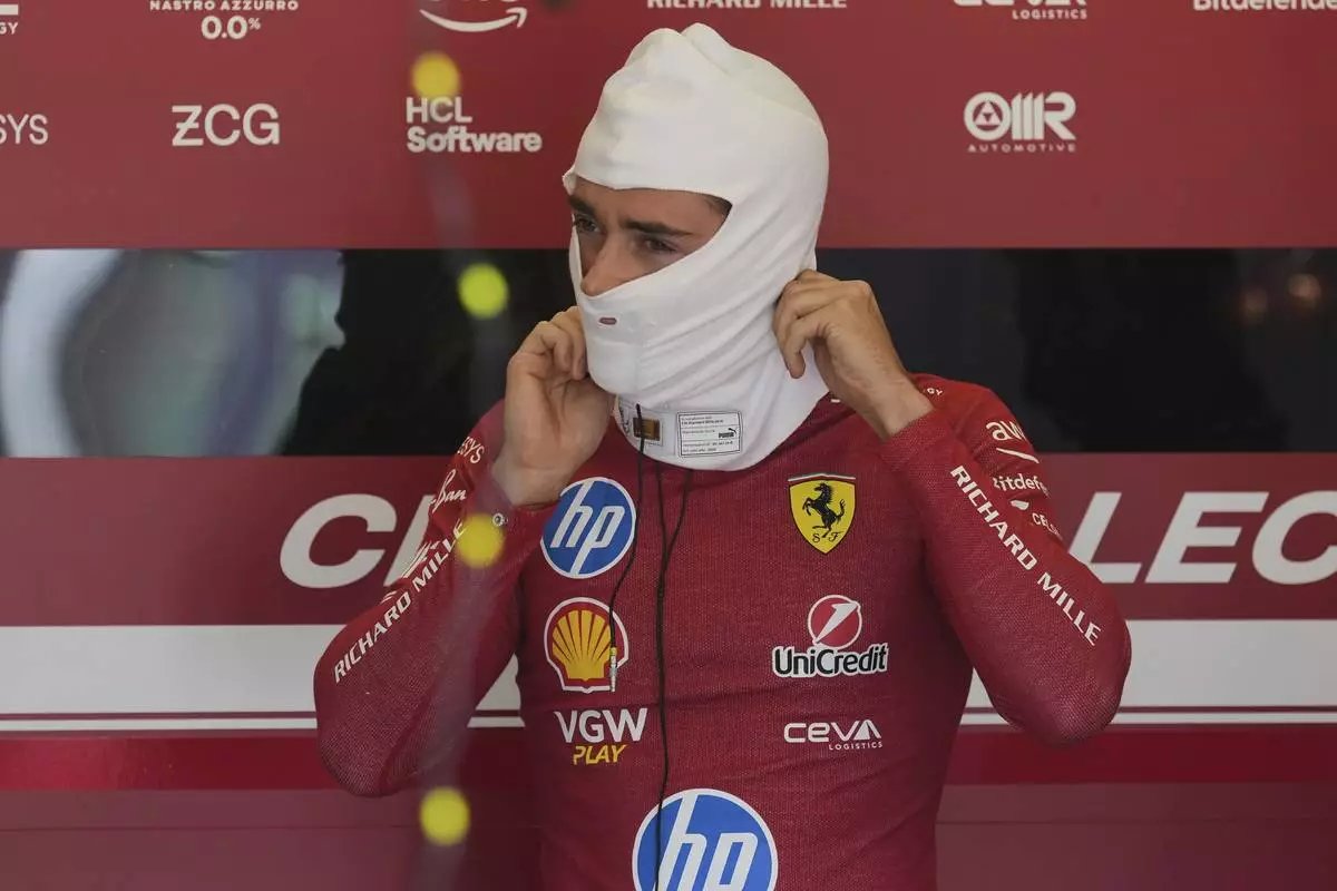 Ferrari driver Charles Leclerc of Monaco prepares for the first free practice at the Enzo and Dino Ferrari racetrack, ahead the Italy's Emilia Romagna Formula One Grand Prix, in Imola, Italy, Friday, May 16, 2025. (AP Photo/Antonio Calanni)