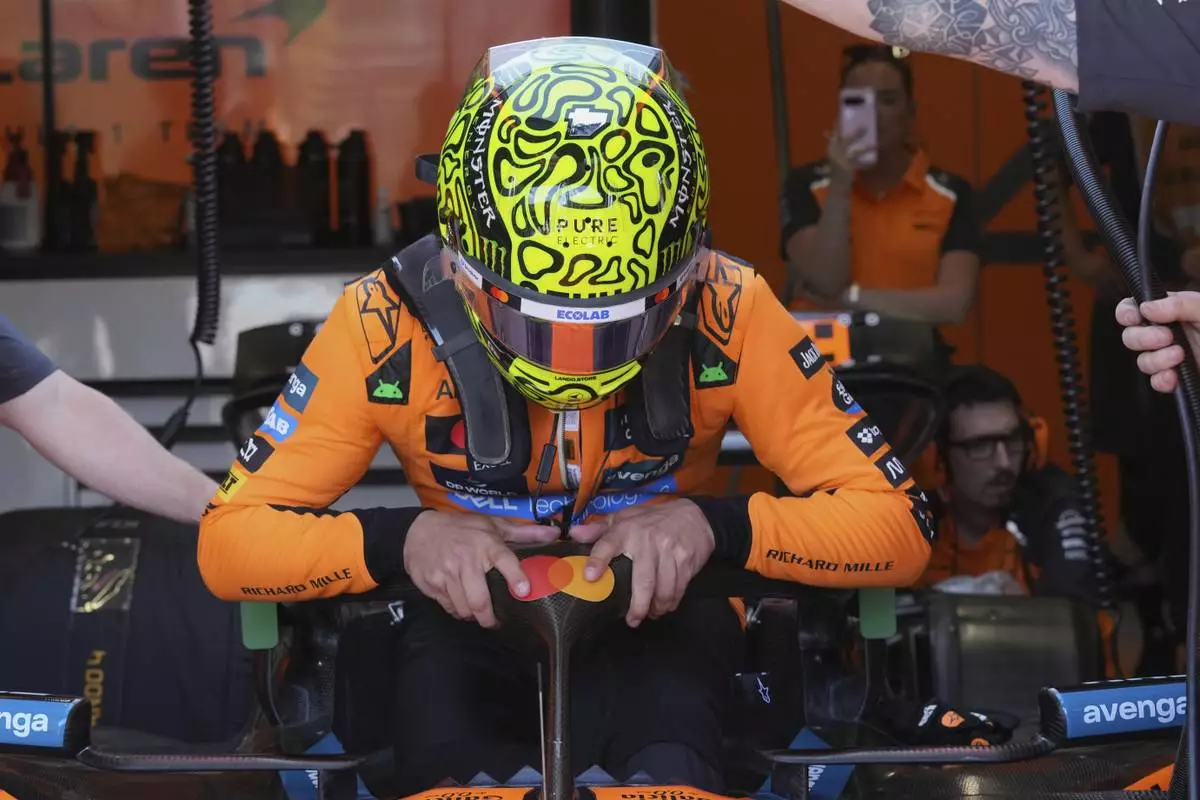 McLaren driver Lando Norris of Britain gets ready during the first free practice at the Enzo and Dino Ferrari racetrack, ahead the Italy's Emilia Romagna Formula One Grand Prix, in Imola, Italy, Friday, May 16, 2025. (AP Photo/Antonio Calanni)
