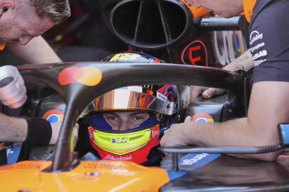 McLaren driver Oscar Piastri of Australia sits in his car during the first free practice at the Enzo and Dino Ferrari racetrack, ahead the Italy's Emilia Romagna Formula One Grand Prix, in Imola, Italy, Friday, May 16, 2025. (AP Photo/Antonio Calanni)