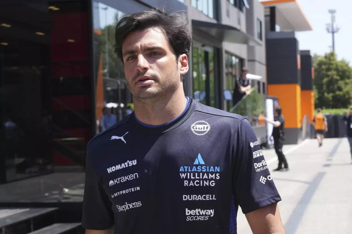 Williams driver Carlos Sainz of Spain arrives at the Dino and Enzo Ferrari racetrack, in Imola, Italy, Thursday, May 15, 2025. (AP Photo/Antonio Calanni)