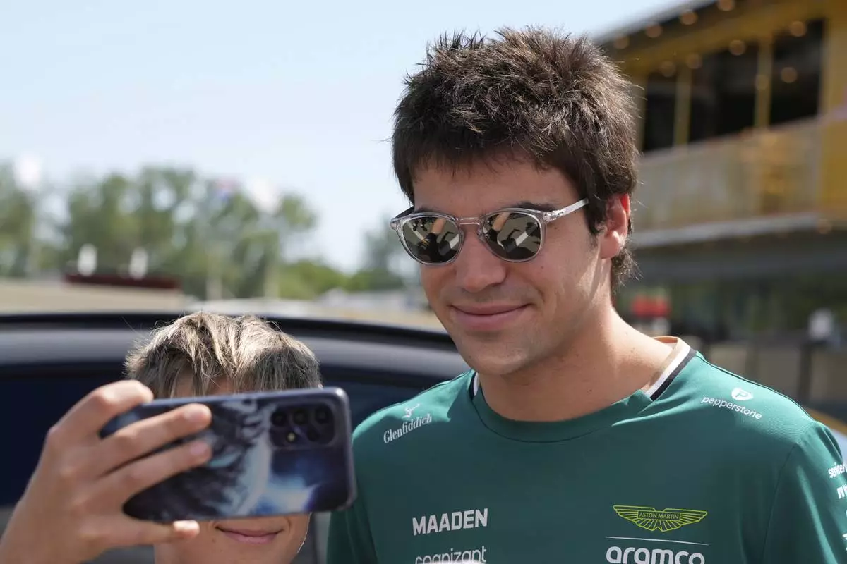 Aston Martin driver Lance Stroll of Canada arrives prior to the first free practice at the Enzo and Dino Ferrari racetrack, ahead the Italy's Emilia Romagna Formula One Grand Prix, in Imola, Italy, Friday, May 16, 2025. (AP Photo/Luca Bruno)