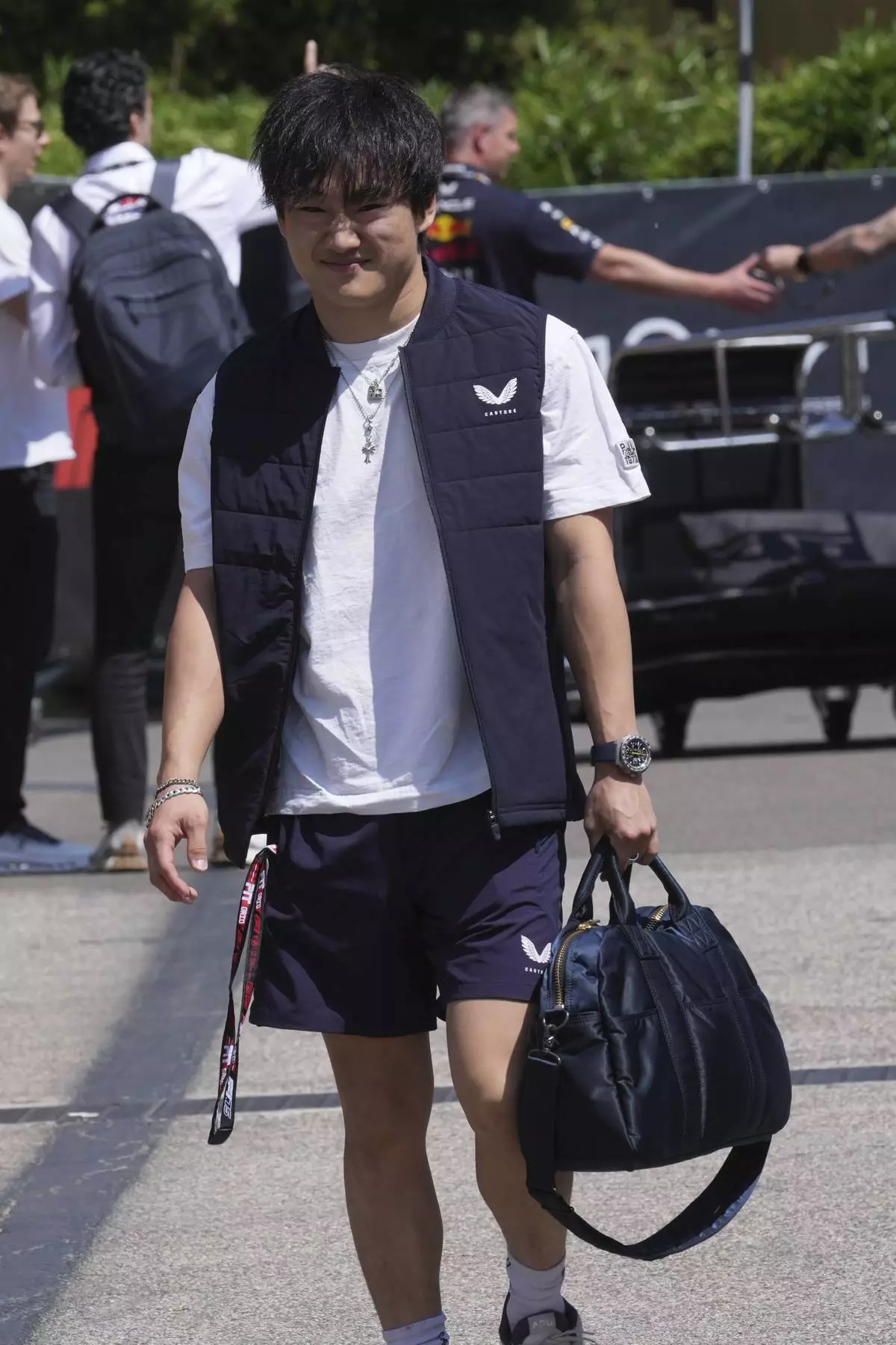 Red Bull driver Yuki Tsunoda of Japan arrives at the Dino and Enzo Ferrari racetrack, ahead the Italy's Emilia Romagna Formula One Grand Prix in Imola, Italy, Thursday, May 15, 2025. (AP Photo/Antonio Calanni)