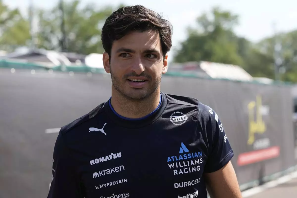 Williams driver Carlos Sainz of Spain arrives prior to the first free practice at the Enzo and Dino Ferrari racetrack, ahead the Italy's Emilia Romagna Formula One Grand Prix, in Imola, Italy, Friday, May 16, 2025. (AP Photo/Luca Bruno)