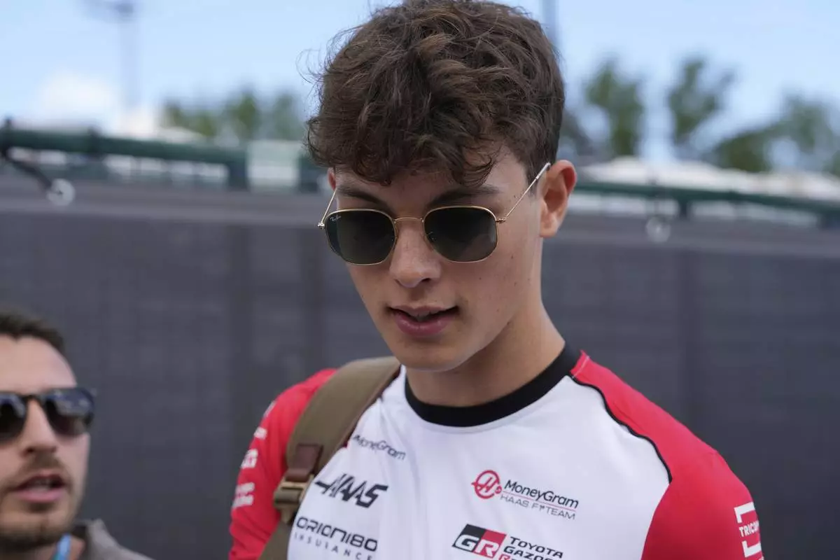 Haas driver Oliver Bearman of Britain arrives prior to the first free practice at the Enzo and Dino Ferrari racetrack, ahead the Italy's Emilia Romagna Formula One Grand Prix, in Imola, Italy, Friday, May 16, 2025. (AP Photo/Luca Bruno)
