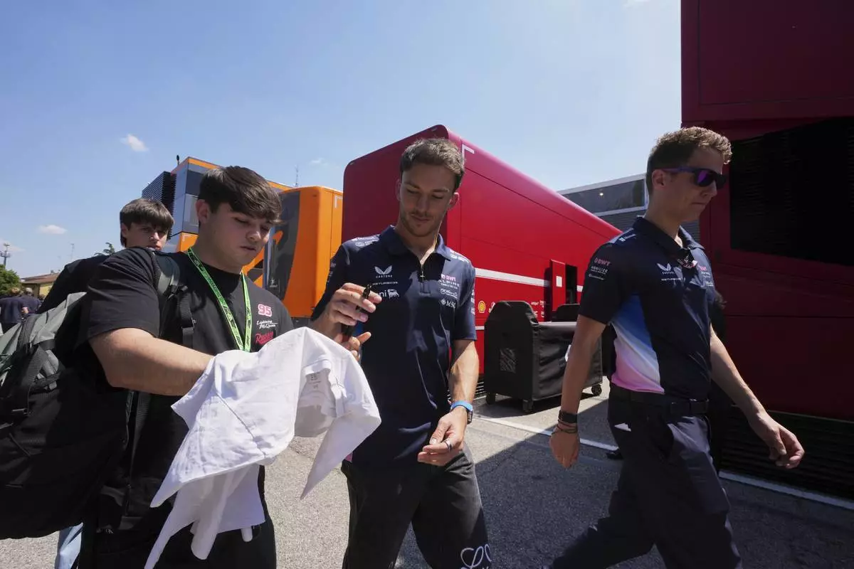 Alpine driver Franco Colapinto of Argentina arrives for the first free practice at the Enzo and Dino Ferrari racetrack, ahead the Italy's Emilia Romagna Formula One Grand Prix, in Imola, Italy, Friday, May 16, 2025. (AP Photo/Antonio Calanni)