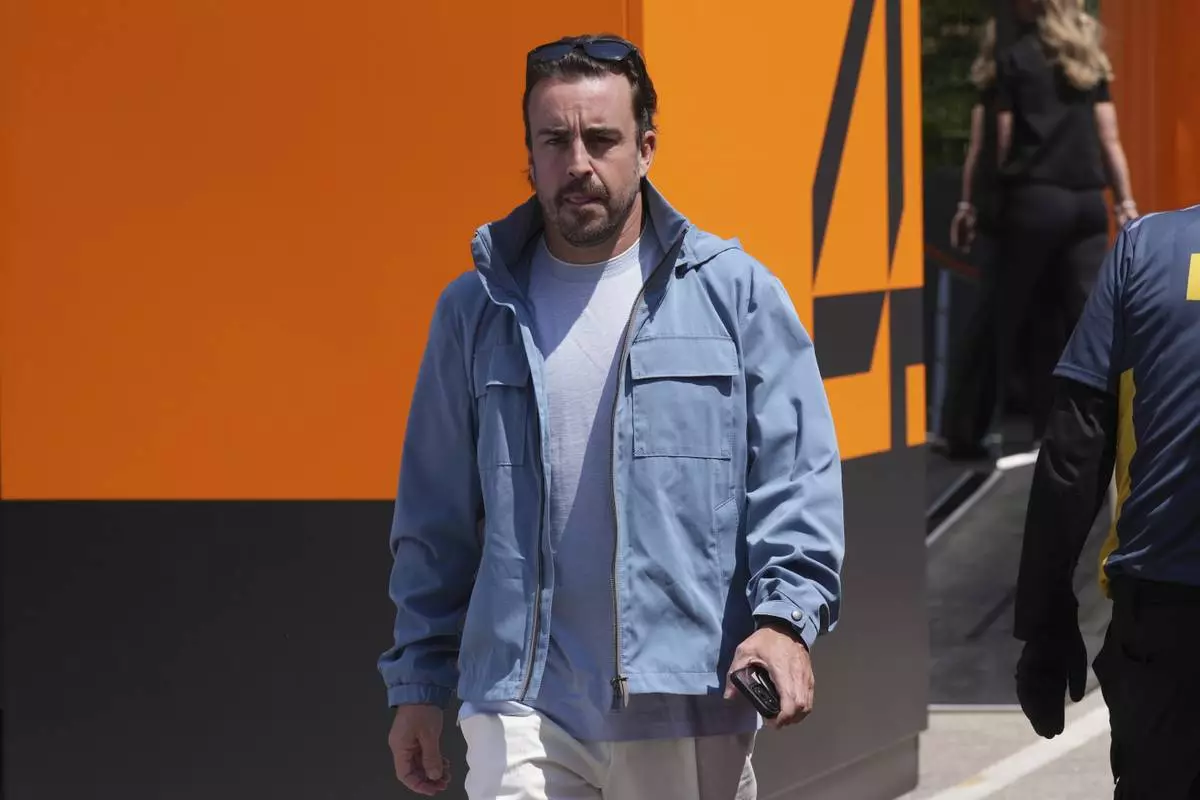 Aston Martin driver Fernando Alonso of Spain arrives for the first free practice at the Enzo and Dino Ferrari racetrack, ahead the Italy's Emilia Romagna Formula One Grand Prix, in Imola, Italy, Friday, May 16, 2025. (AP Photo/Antonio Calanni)