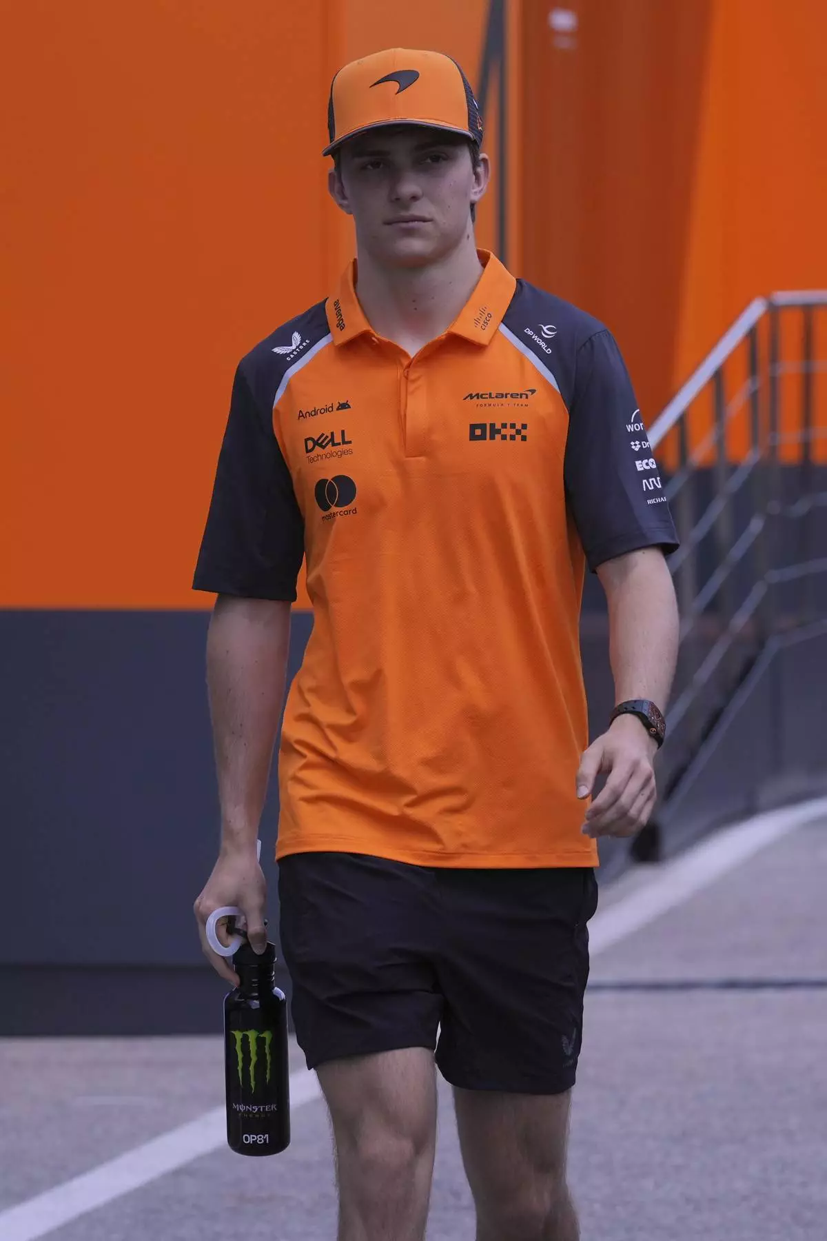 McLaren driver Oscar Piastri of Australia walks in the paddock at the Dino and Enzo Ferrari racetrack, ahead the Italy's Emilia Romagna Formula One Grand Prix in Imola, Italy, Thursday, May 15, 2025. (AP Photo/Antonio Calanni)