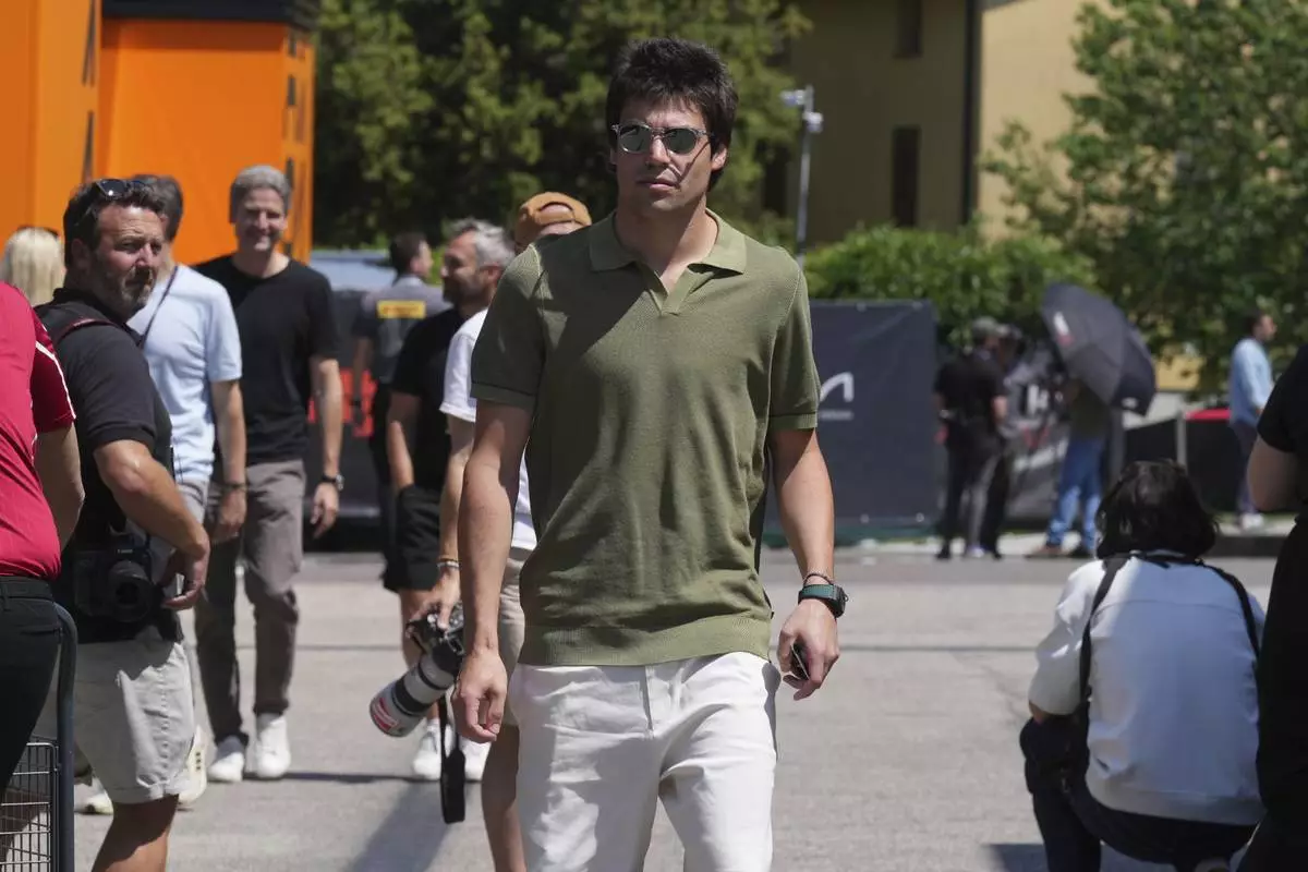 Aston Martin driver Lance Stroll of Canada arrives for the first free practice at the Enzo and Dino Ferrari racetrack, ahead the Italy's Emilia Romagna Formula One Grand Prix, in Imola, Italy, Friday, May 16, 2025. (AP Photo/Antonio Calanni)