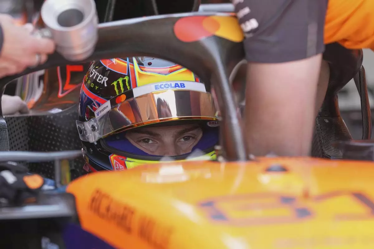 McLaren driver Oscar Piastri of Australia sits in his car during the first free practice at the Enzo and Dino Ferrari racetrack, ahead the Italy's Emilia Romagna Formula One Grand Prix, in Imola, Italy, Friday, May 16, 2025. (AP Photo/Antonio Calanni)