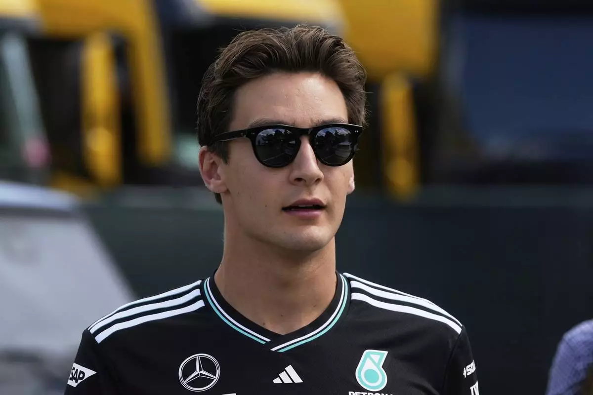 Mercedes driver George Russell of Britain arrives prior to the first free practice at the Enzo and Dino Ferrari racetrack, ahead the Italy's Emilia Romagna Formula One Grand Prix, in Imola, Italy, Friday, May 16, 2025. (AP Photo/Luca Bruno)