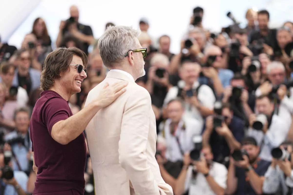 Tom Cruise, left and director Christopher McQuarrie pose for photographers during the photo call for the film 'Mission: Impossible – The Final Reckoning' at the 78th international film festival, Cannes, southern France, Wednesday, May 14, 2025. (Photo by Scott A Garfitt/Invision/AP)