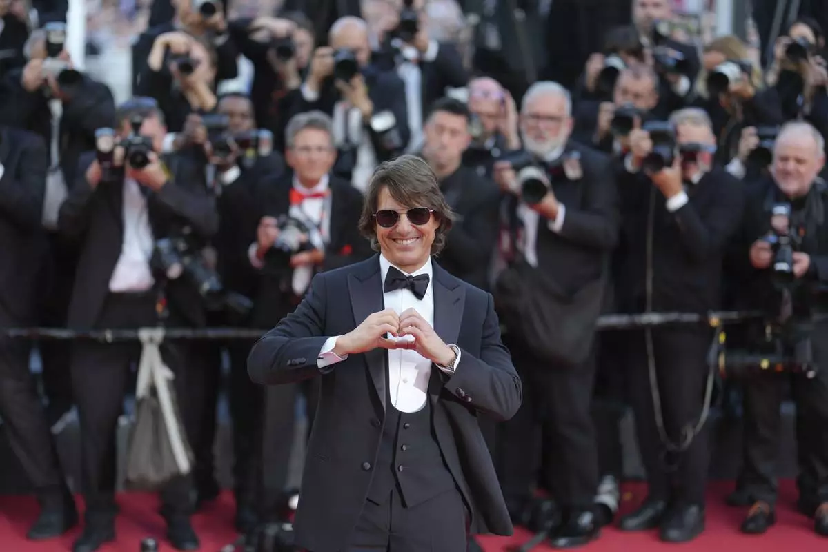 Tom Cruise poses for photographers upon arrival at the premiere of the film 'Mission: Impossible - The Final Reckoning' at the 78th international film festival, Cannes, southern France, Wednesday, May 14, 2025. (Photo by Lewis Joly/Invision/AP)