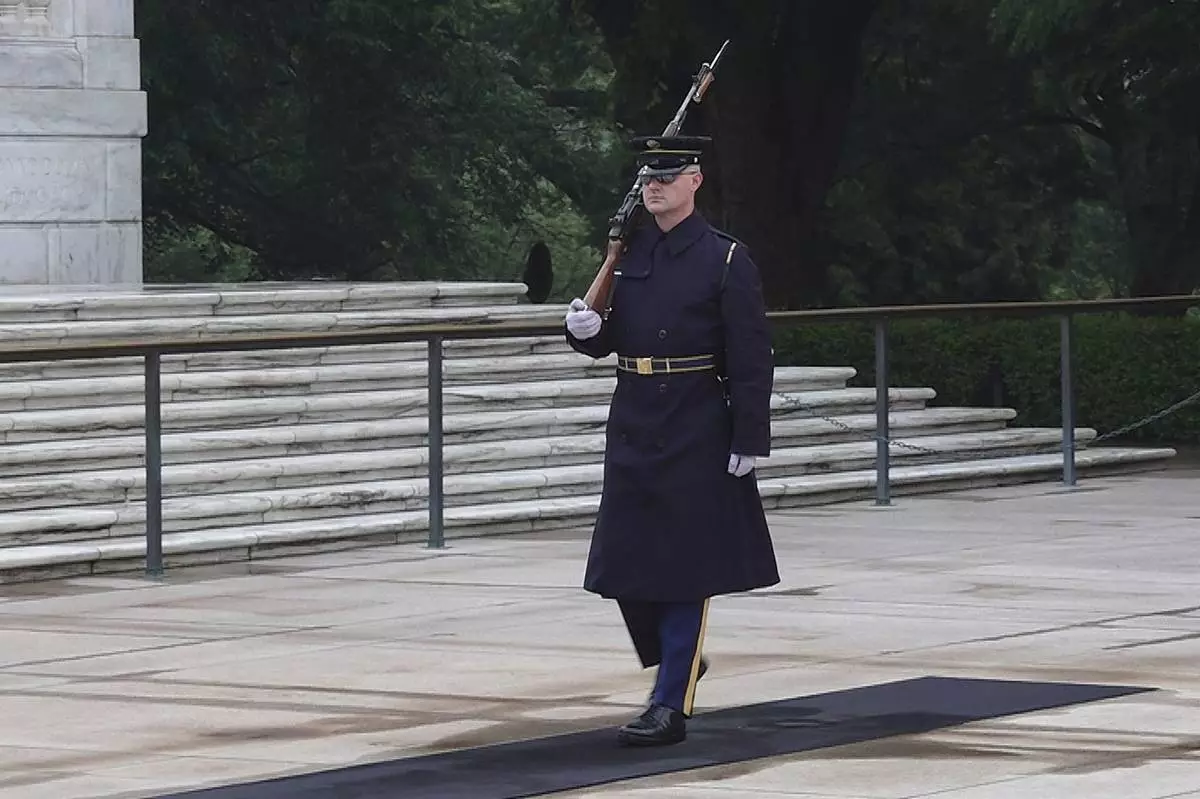 Army Sgt. 1st Class Andrew Jay patrols the Tomb of the Unknown Soldier, Thursday, May 15, 2025, at Arlington National Cemetery in Arlington, Va. (AP Photo/Mike Pesoli)
