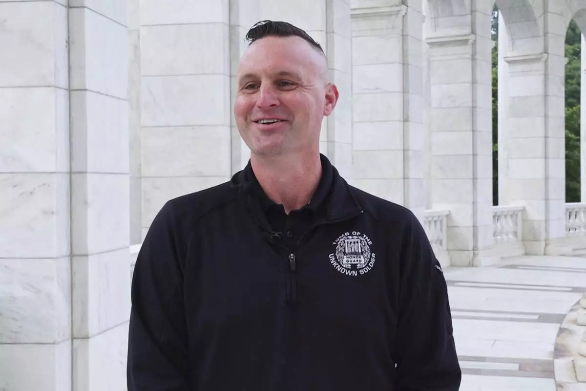 Army Sgt. 1st Class Andrew Jay speaks during an interview with The Associated Press, Thursday, May 15, 2025, at Arlington National Cemetery in Arlington, Va. (AP Photo/Mike Pesoli)