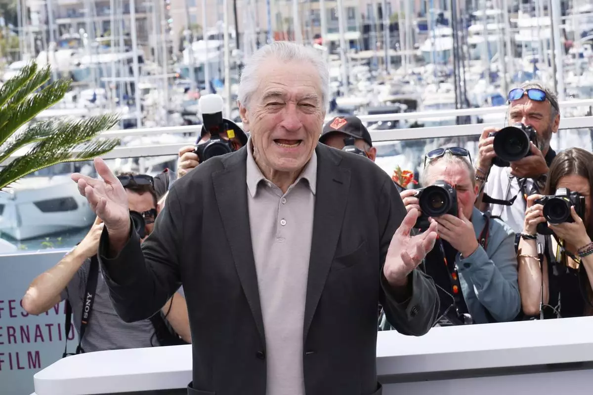Honorary Palme d'Or recipient Robert De Niro poses for photographers during a photo call at the 78th international film festival, Cannes, southern France, Tuesday, May 13, 2025. (Photo by Joel C Ryan/Invision/AP)