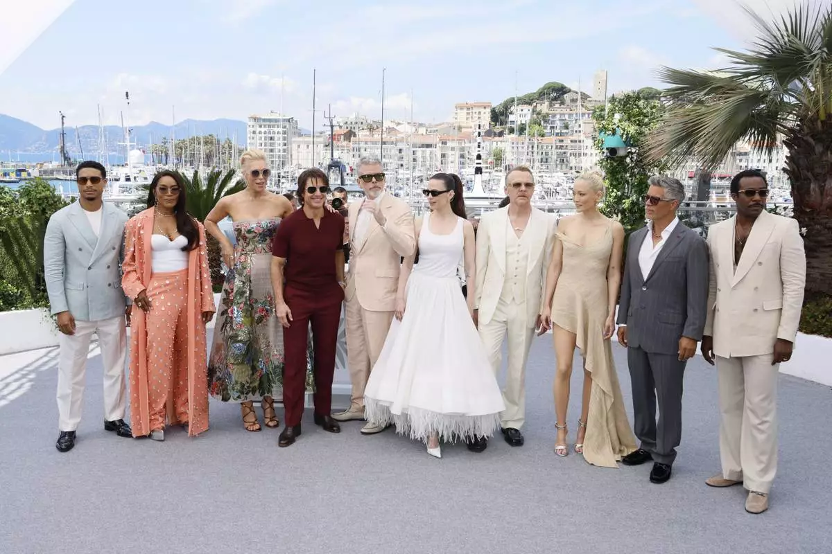 Greg Tarzan Davis, from left, Angela Bassett, Hannah Waddingham, Tom Cruise, director Christopher McQuarrie, Hayley Atwell, Simon Pegg, Pom Klementieff, Esai Morales, and Tramell Tillman pose for photographers during the photo call for the film 'Mission: Impossible – The Final Reckoning' at the 78th international film festival, Cannes, southern France, Wednesday, May 14, 2025. (Photo by Joel C Ryan/Invision/AP)