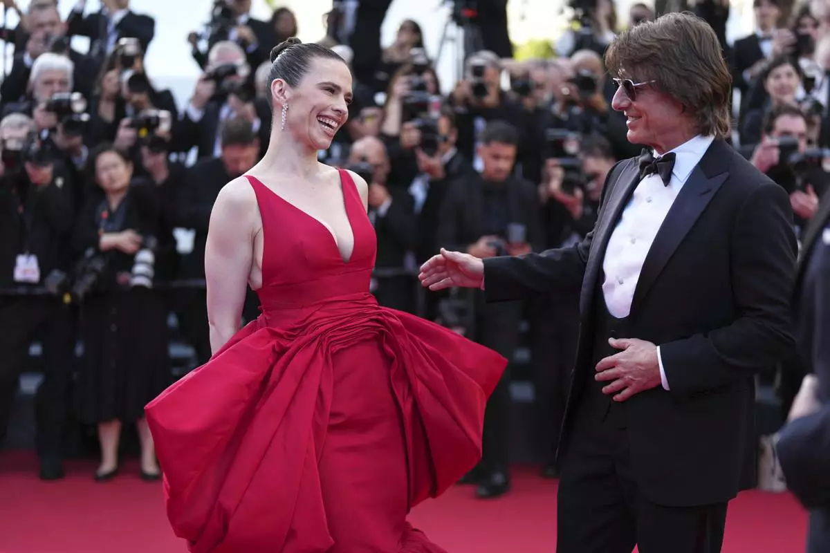 Hayley Atwell, left, and Tom Cruise pose for photographers upon arrival at the premiere of the film 'Mission: Impossible - The Final Reckoning' at the 78th international film festival, Cannes, southern France, Wednesday, May 14, 2025. (Photo by Scott A Garfitt/Invision/AP)