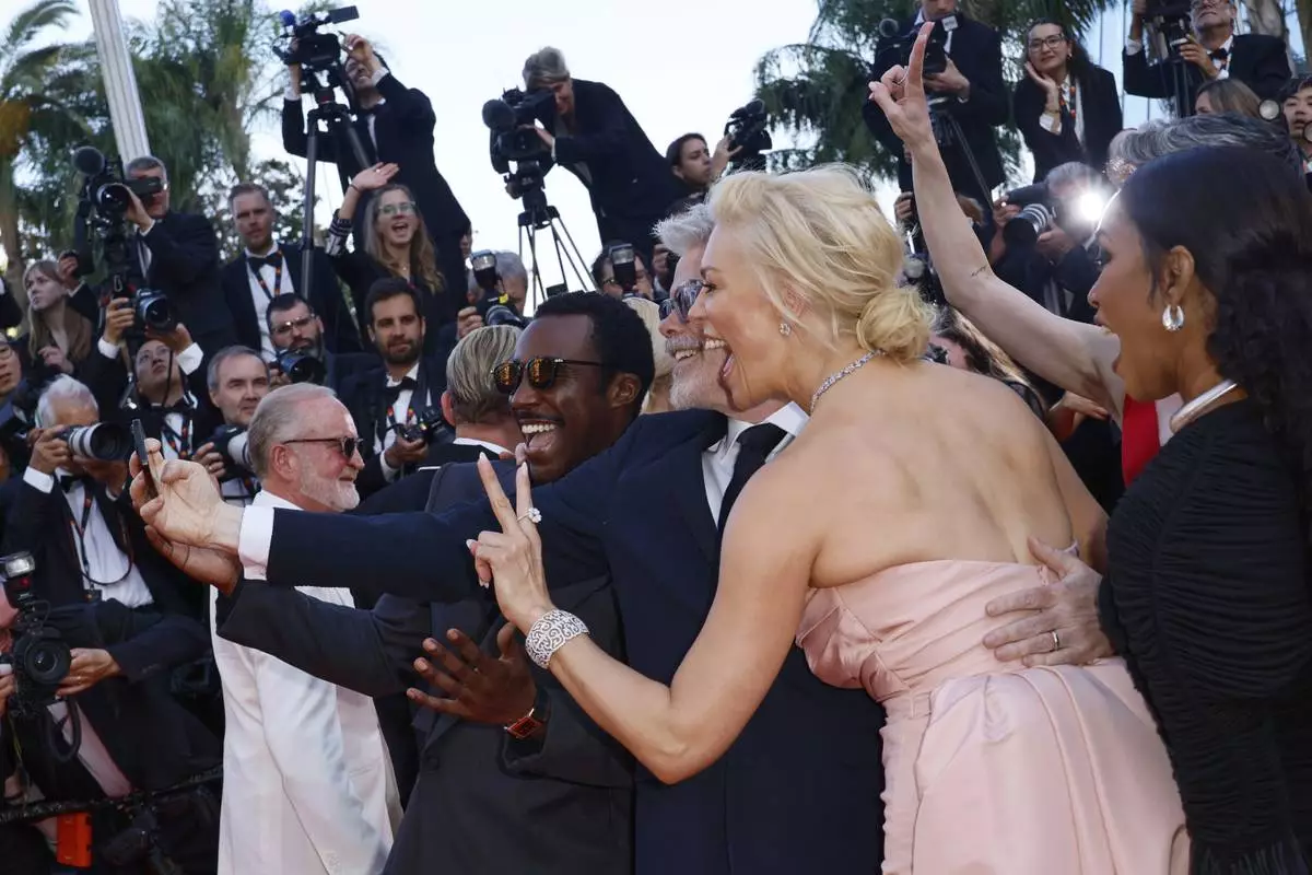 Tramell Tillman, from left, director Christopher McQuarrie, Hannah Waddingham, and Angela Bassett take a selfie upon arrival for the premiere of the film 'Mission: Impossible - The Final Reckoning' at the 78th international film festival, Cannes, southern France, Wednesday, May 14, 2025. (Photo by Joel C Ryan/Invision/AP)
