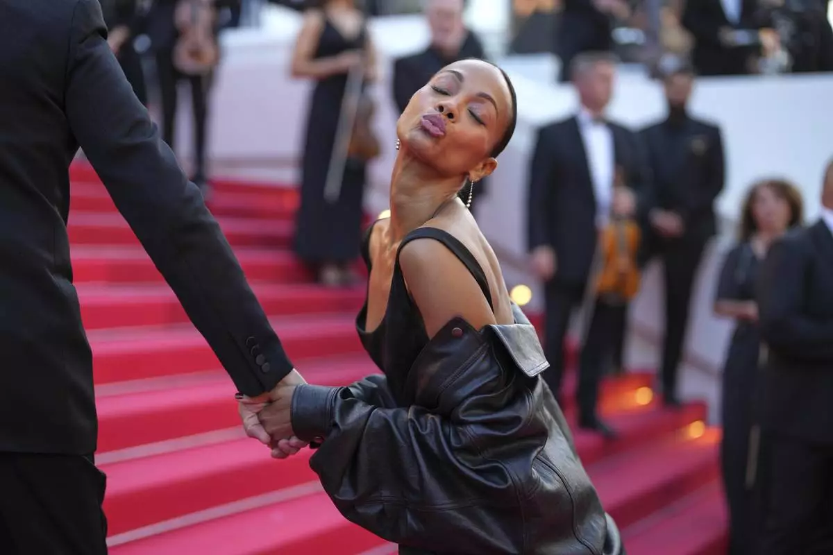 Zoe Saldana poses for photographers upon arrival at the premiere of the film 'Mission: Impossible - The Final Reckoning' at the 78th international film festival, Cannes, southern France, Wednesday, May 14, 2025. (AP Photo/Natacha Pisarenko)