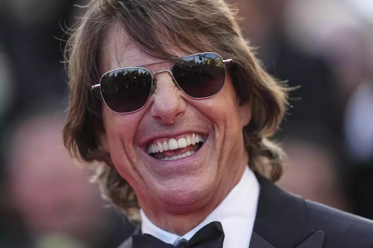 Tom Cruise poses for photographers upon arrival at the premiere of the film 'Mission: Impossible - The Final Reckoning' at the 78th international film festival, Cannes, southern France, Wednesday, May 14, 2025. (Photo by Scott A Garfitt/Invision/AP)