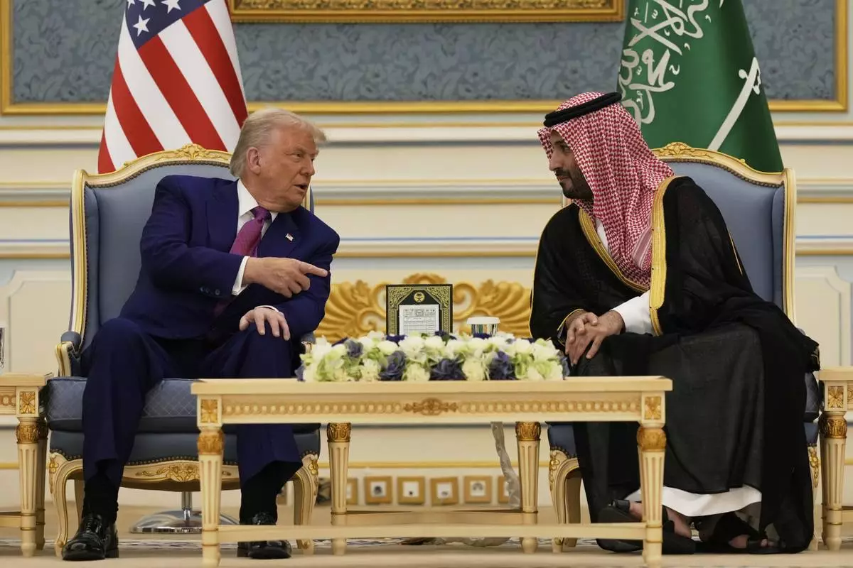President Donald Trump and Saudi Crown Prince Mohammed bin Salman speak during a meeting at the Royal Palace in Riyadh, Saudi Arabia, Tuesday, May 13, 2025. (AP Photo/Alex Brandon)