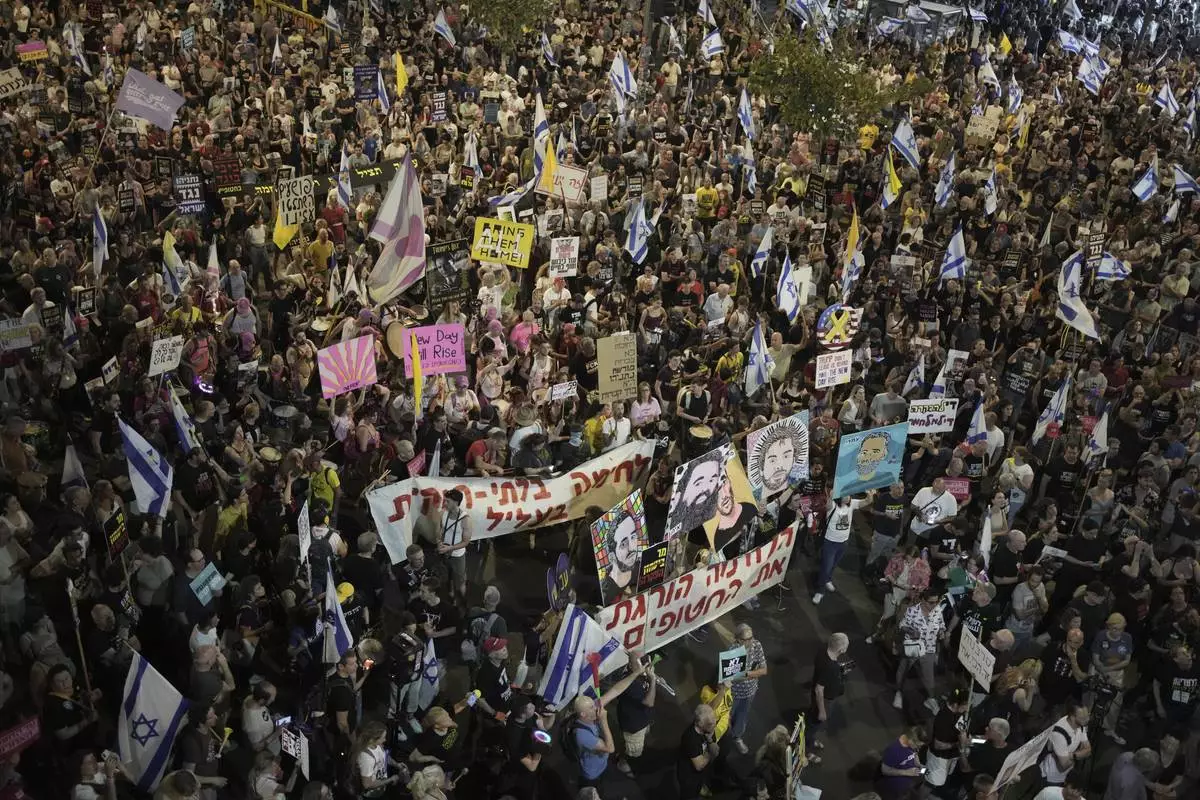 People take part in a protest demanding the end of the war and immediate release of hostages held by Hamas in the Gaza Strip, and and against Prime Minister Benjamin Netanyahu's government in Tel Aviv, Israel, Saturday, May 17, 2025.(AP Photo/Maya Alleruzzo)