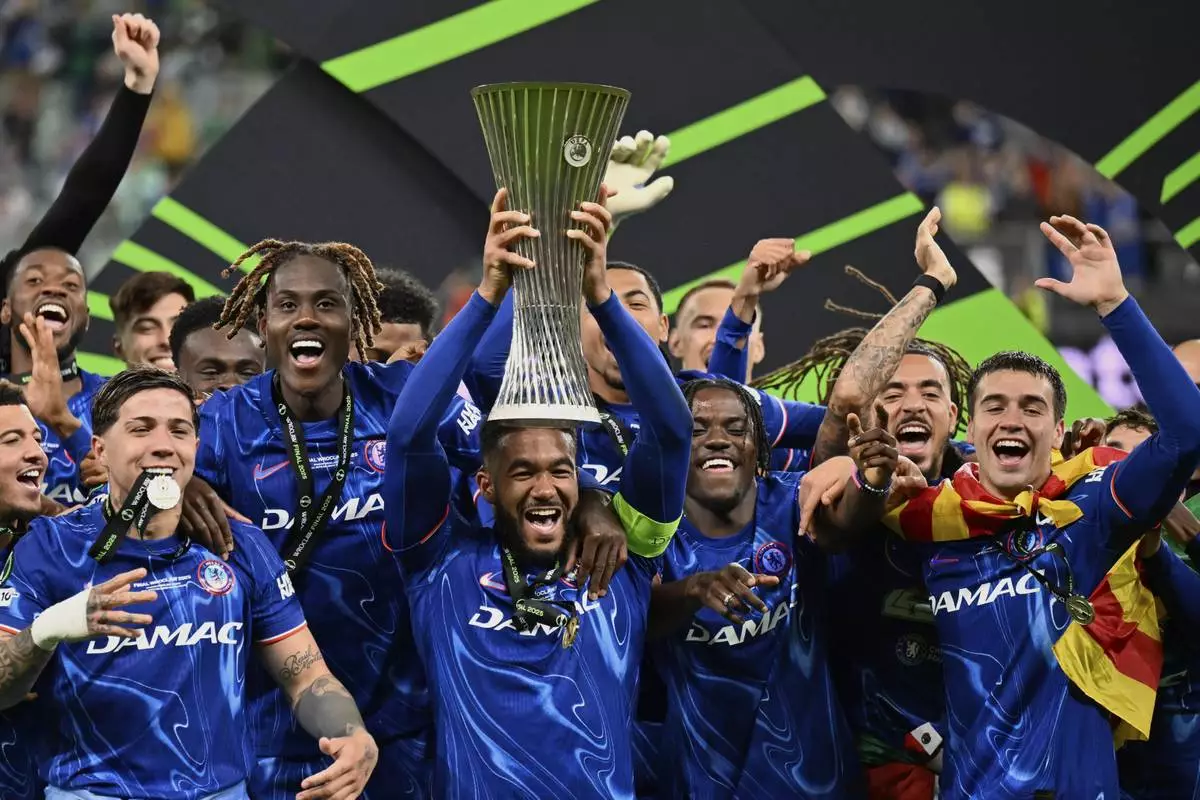 Chelsea's Reece James lifts the trophy after the Europa Conference League final soccer match between Real Betis and Chelsea in Wroclaw, Poland, Wednesday, May 28, 2025. (AP Photo/Denes Erdos)