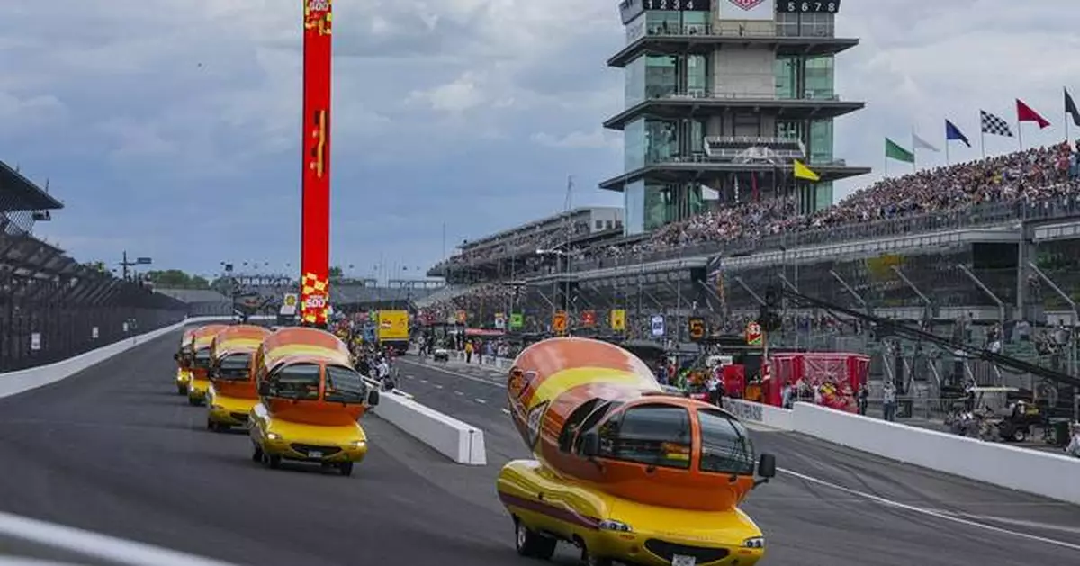 Hot diggity dog! Wienermobiles put on riveting race in Wienie 500 at Indianapolis Motor Speedway