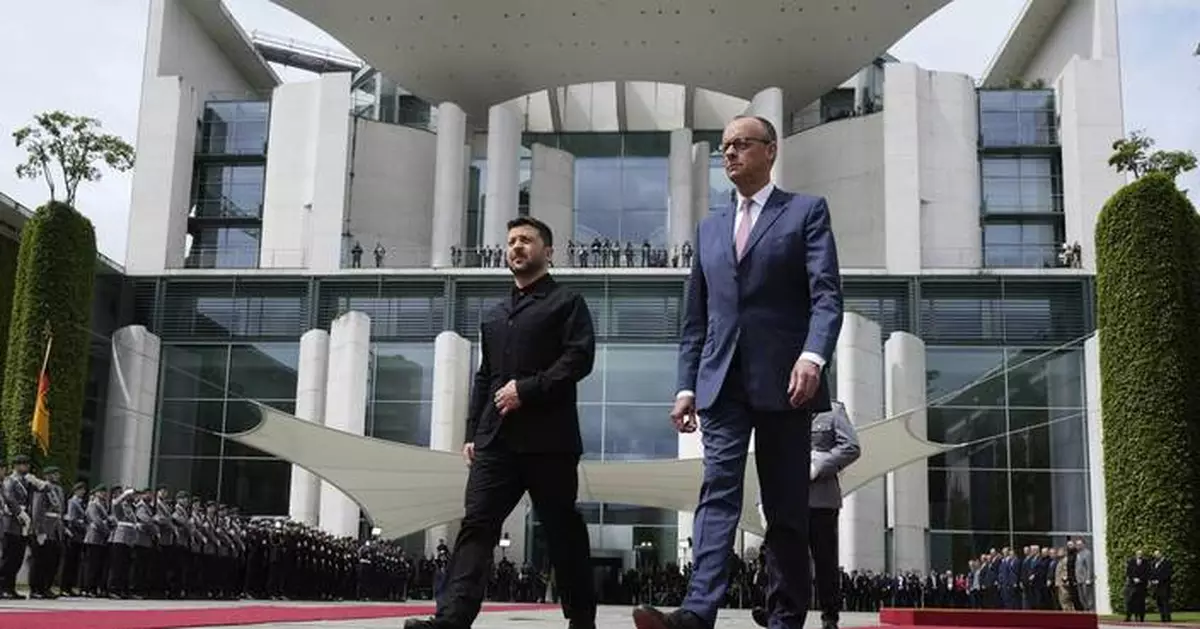 AP PHOTOS: Zelenskyy in Berlin seeking more support for Ukraine defense as Russian attacks intensify
