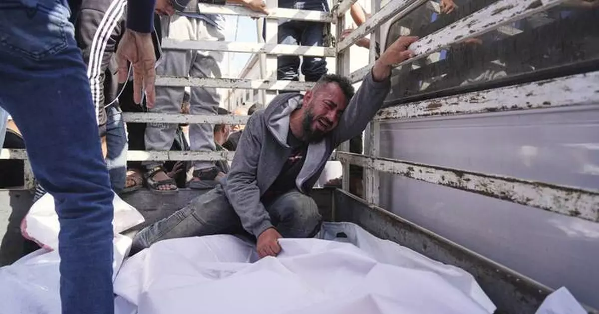 At least 60 people killed by Israeli strikes in Gaza as Israel lets minimal aid in