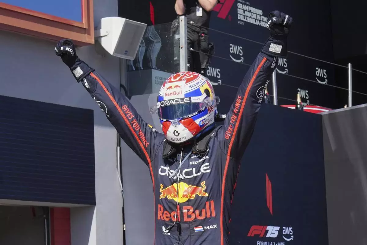 Red Bull driver Max Verstappen of the Netherlands celebrates winning the Italy's Emilia Romagna Formula One Grand Prix, in Imola, Italy, Sunday, May 18, 2025. (AP Photo/Antonio Calanni)