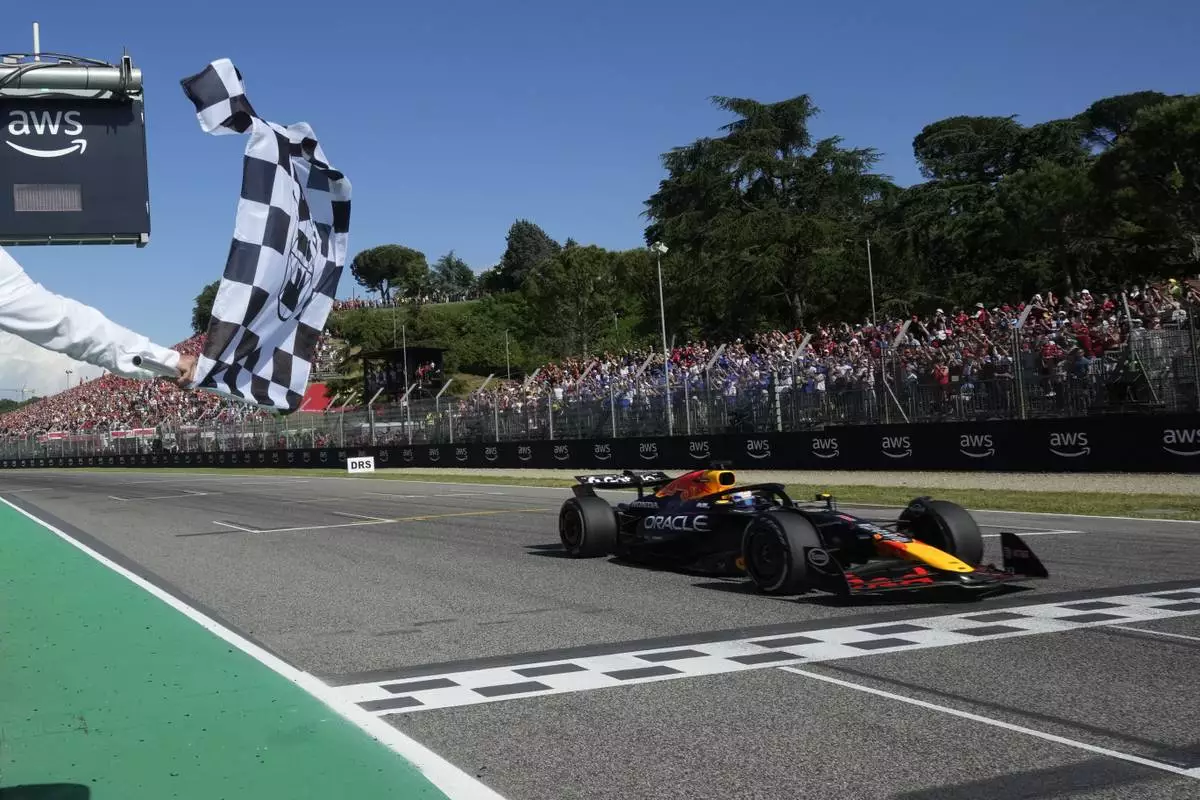 Red Bull driver Max Verstappen of the Netherlands crosses the finish line to win the Italian Emilia Romagna Formula One Grand Prix, at the Enzo and Dino Ferrari racetrack in Imola, Italy, Sunday, May 18, 2025. (AP Photo/Luca Bruno, Pool)