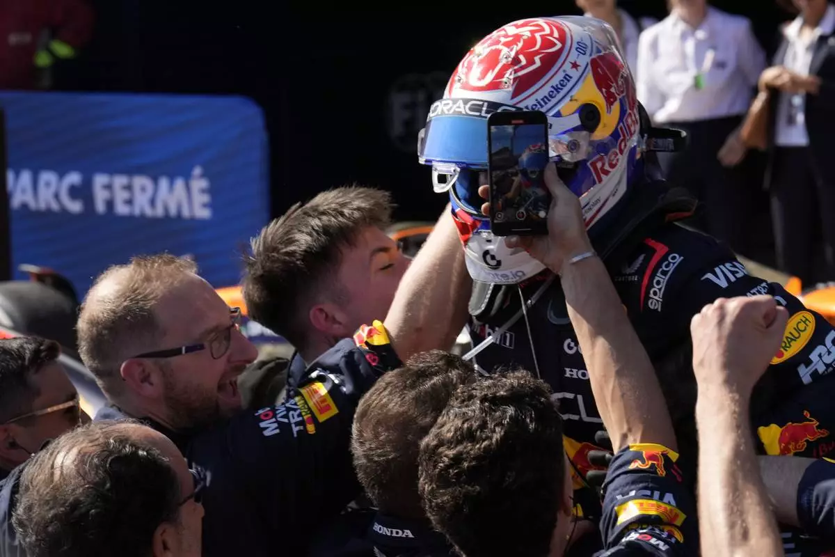 Red Bull driver Max Verstappen of the Netherlands celebrates after winning the Italian Emilia Romagna Formula One Grand Prix, at the Enzo and Dino Ferrari racetrack in Imola, Italy, Sunday, May 18, 2025. (AP Photo/Luca Bruno)