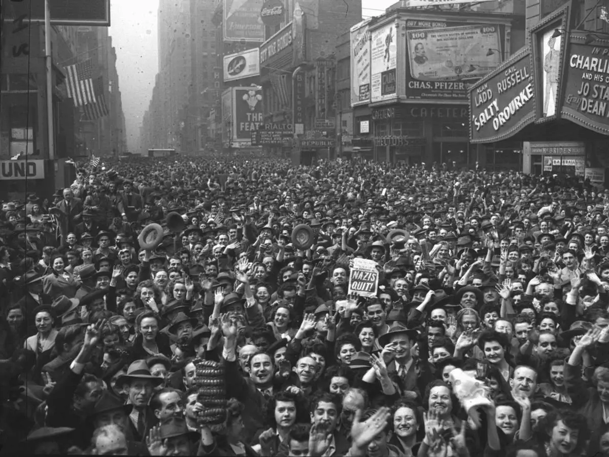 FILE - This general view of Times Square, New York at 11 a.m. on May 7, 1945, shows New Yorkers jamming the streets to cheer the news of the unconditional surrender of Germany. (AP Photo/Harry Harris, File)