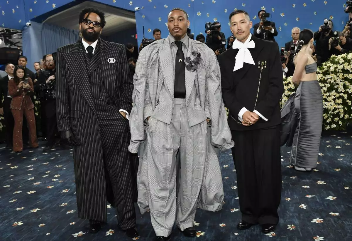 Dao-Yi Chow, from left Justin Jefferson and Maxwell Osborne attend The Metropolitan Museum of Art's Costume Institute benefit gala celebrating the opening of the "Superfine: Tailoring Black Style" exhibition on Monday, May 5, 2025, in New York. (Photo by Evan Agostini/Invision/AP)