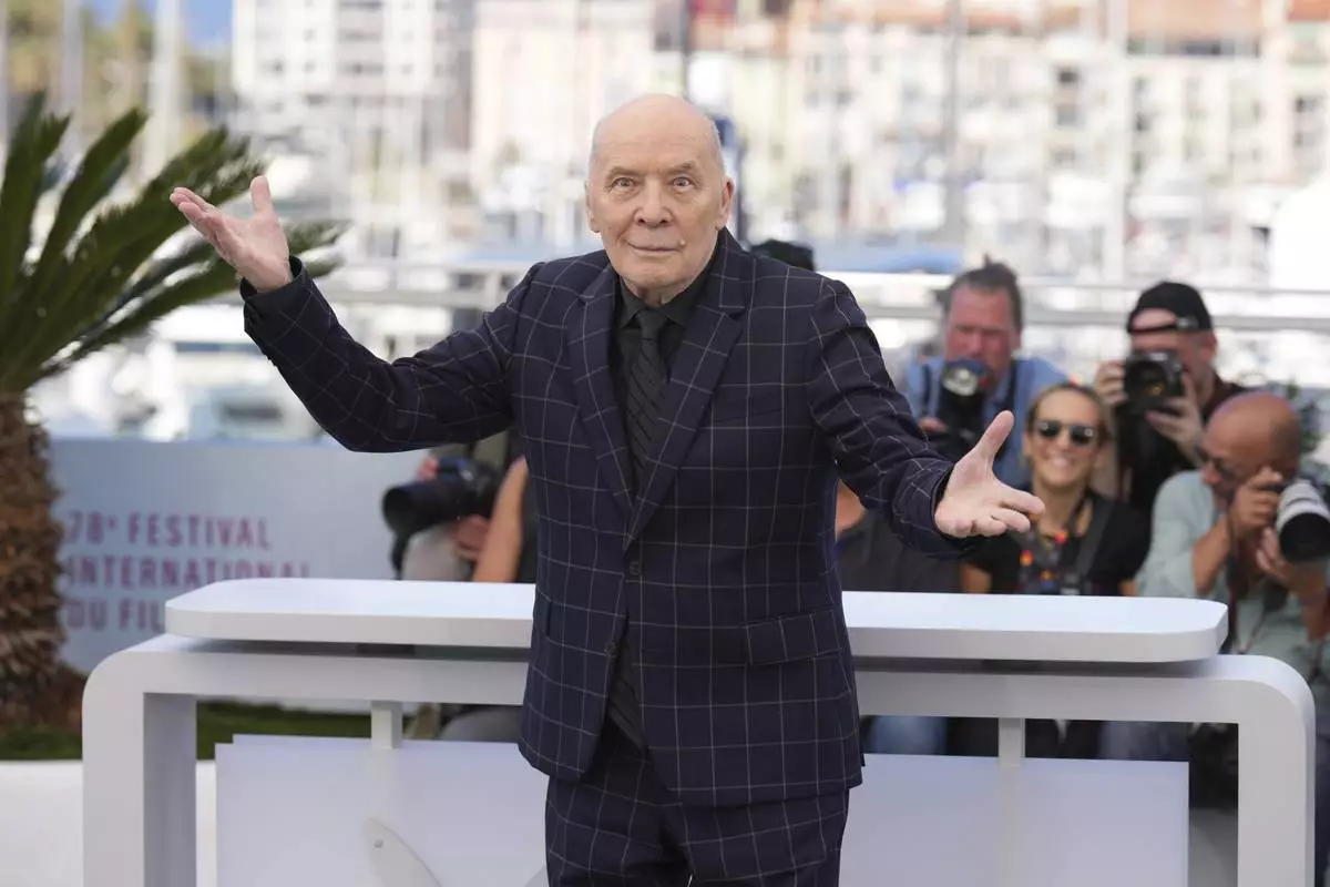 Aleksandr Filippenko poses for photographers at the photo call for the film 'Two Prosecutors' at the 78th international film festival, Cannes, southern France, Thursday, May 15, 2025. (AP Photo/Natacha Pisarenko)