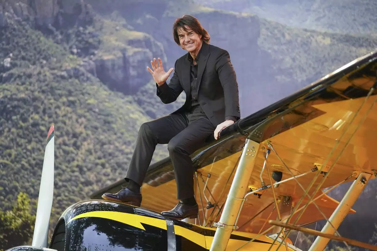 Tom Cruise poses for photographers upon arrival at the premiere of the film 'Mission: Impossible - The Final Reckoning' on Thursday, May 15, 2025, in London. (Photo by Alberto Pezzali/Invision/AP)