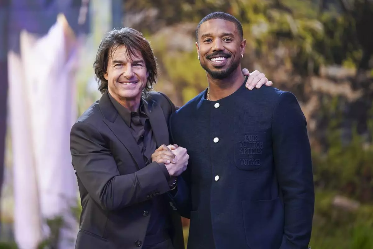 Tom Cruise, left, and Michael B. Jordan pose for photographers upon arrival at the premiere of the film 'Mission: Impossible - The Final Reckoning' on Thursday, May 15, 2025, in London. (Photo by Alberto Pezzali/Invision/AP)