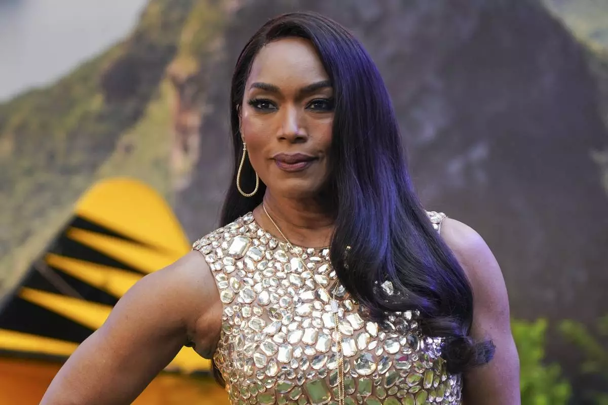 Angela Bassett poses for photographers upon arrival at the premiere of the film 'Mission: Impossible - The Final Reckoning' on Thursday, May 15, 2025, in London. (Photo by Alberto Pezzali/Invision/AP)